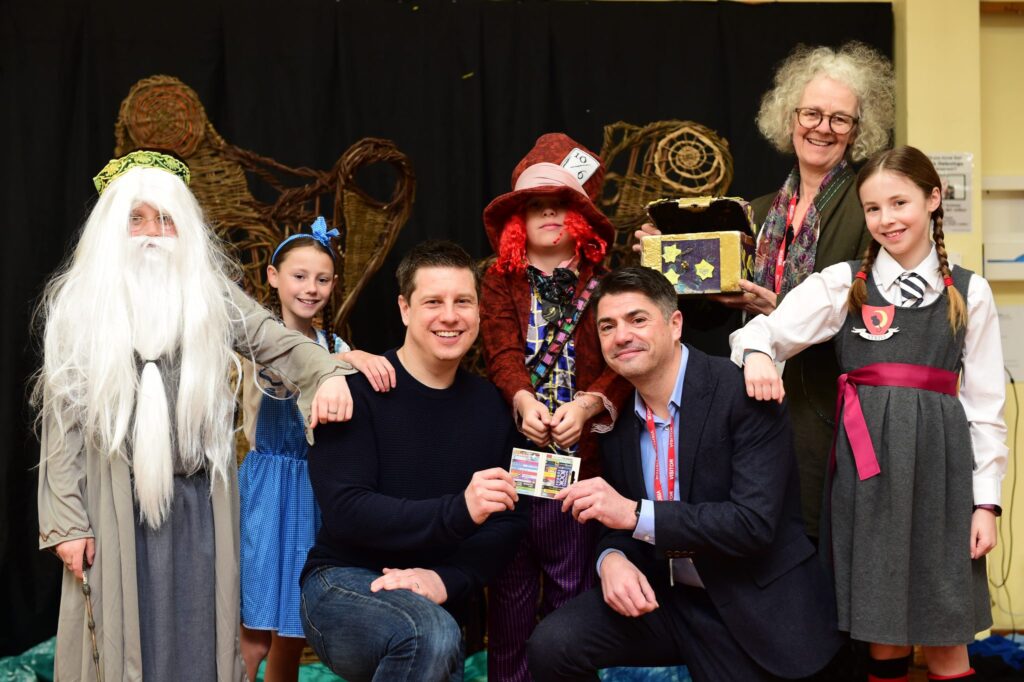 Storyteller Marion Leeper with teacher Peter Ingham, left, Kings Dyke plant manager Paul Fitzjohn and students