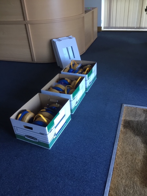 Defibrillators being boxed up ready for delivery