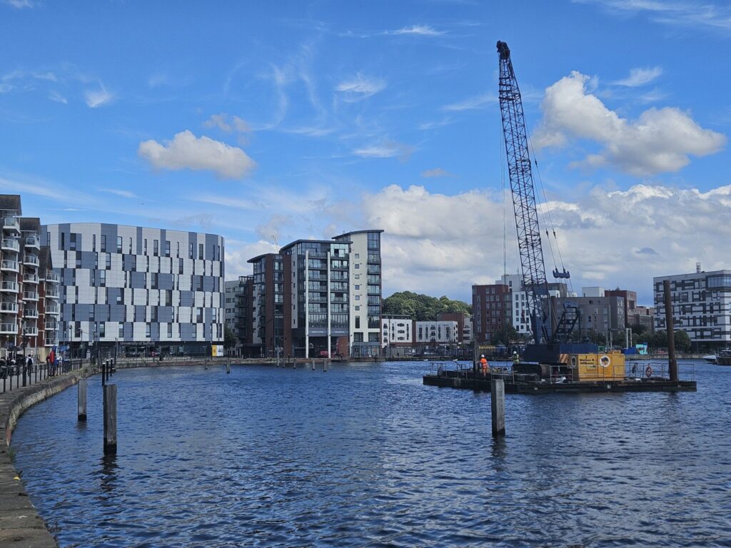 A crane in the water at Ipswich Waterfront as part of the Ipswich Beacon Marina redevelopment