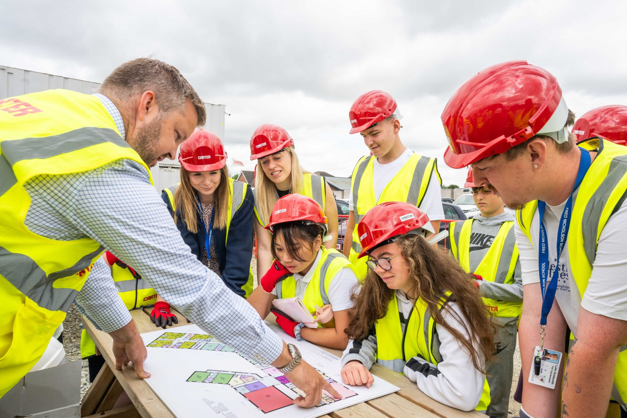 Children looking at the plans for their new school