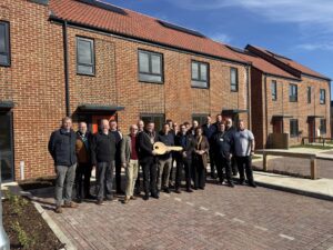 Representatives from Handford Homes and Gipping Construction at the handover ceremony outside the new build homes